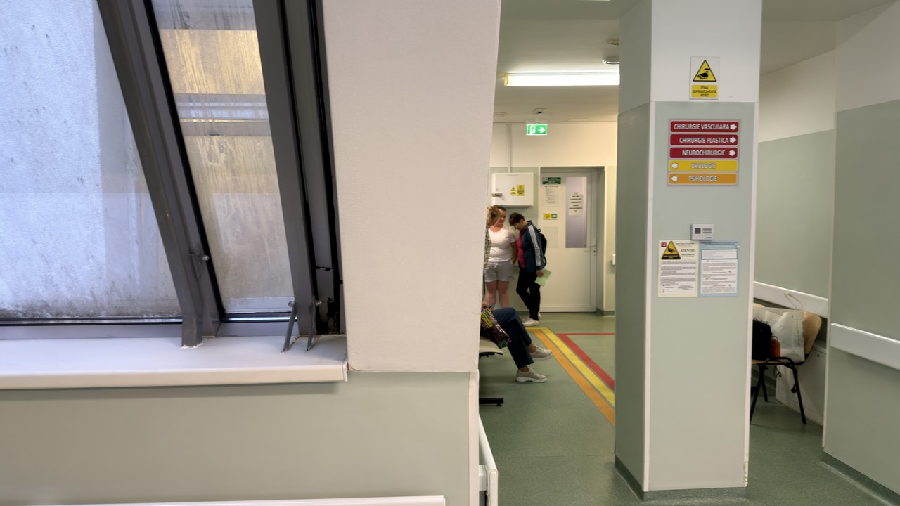 Institutional corridor with safety signage and colored floor markings, representing the organized professional environment of medical facilities featured in local search directories.