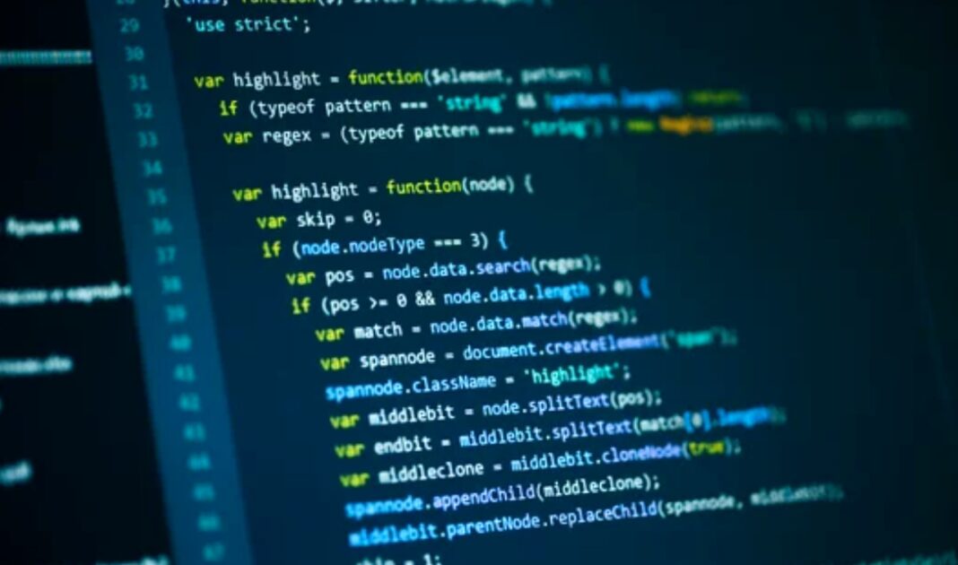 JavaScript code display illustrates the difference between source code and DOM rendering that search engines interpret Computer monitor displays JavaScript code with syntax highlighting showing DOM manipulation functions, illustrating the technical difference between source code and rendered web pages.