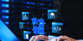 Breadcrumb Schema: Enhancing Navigation in SERPs Hands typing on laptop keyboard with blue holographic overlay showing puzzle pieces, code symbols, and hierarchical diagrams, representing structured data architecture for website navigation.