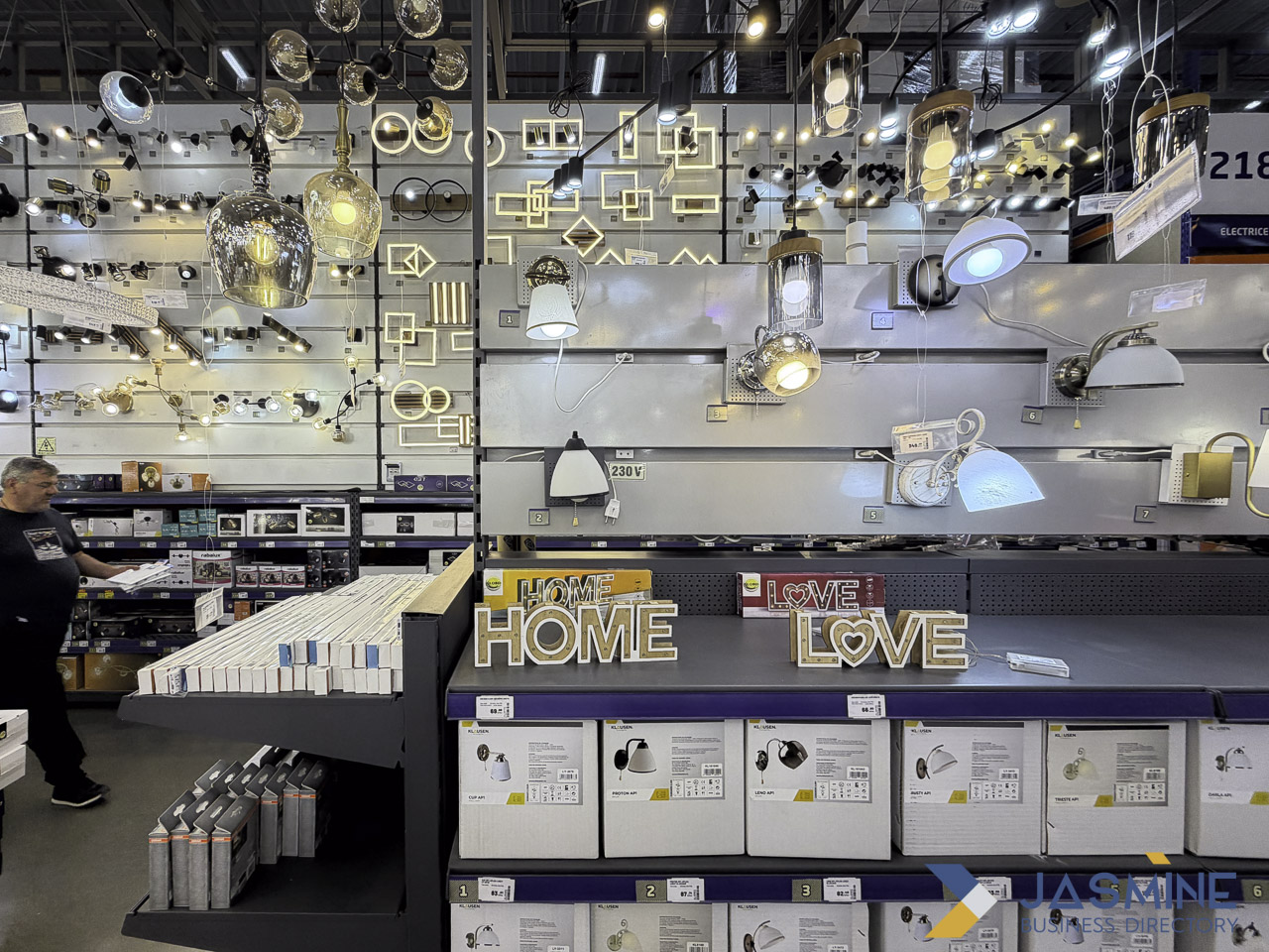Interior of a lighting showroom with illuminated pendant lamps and product displays, demonstrating professional photography for business listings.