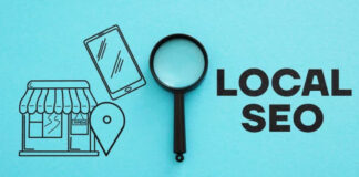 Flat-lay composition with black magnifying glass and illustrated storefront, smartphone, and location pin on turquoise background, representing local search engine optimization concepts for neighborhood businesses.