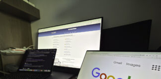 From figures to decisions: how to build a career around business analysis Three-screen computer workstation showing Google search, business directory website, and code editor, representing the digital tools that connect local businesses with global search platforms.