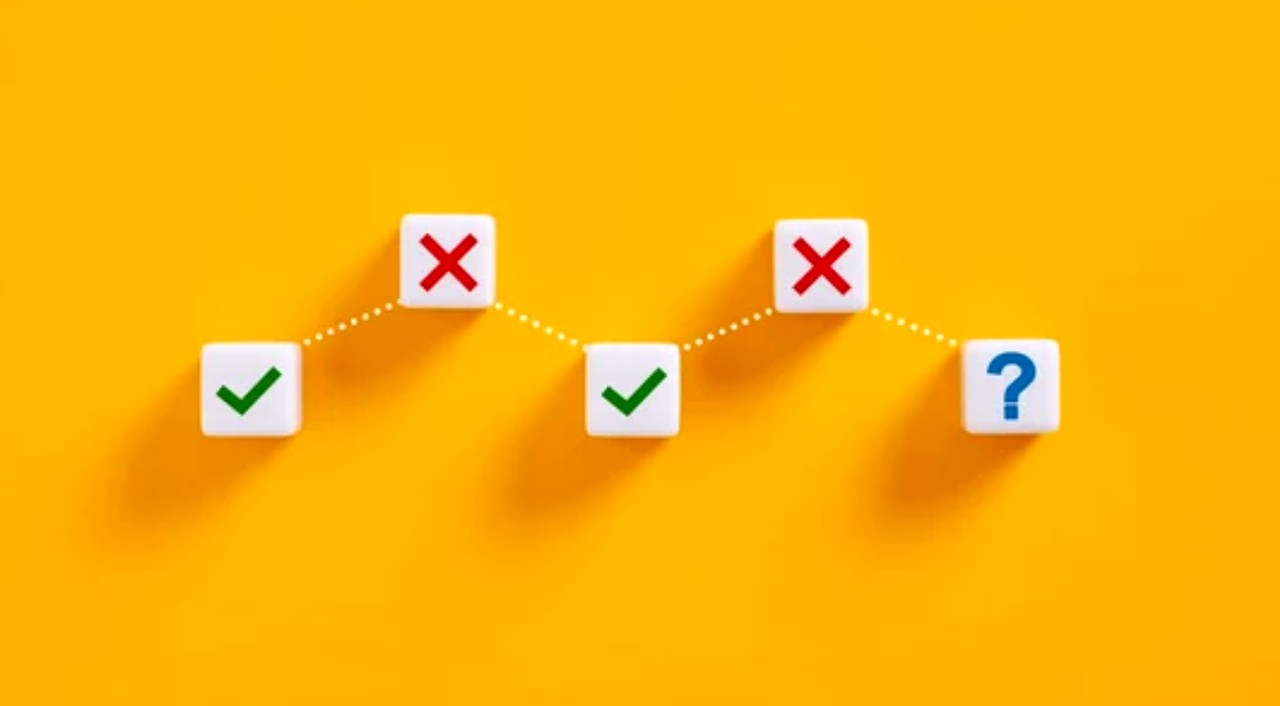 Network diagram with white cubes showing checkmarks, X marks, and a question mark on orange background, representing the decision process for testing AI content visibility.