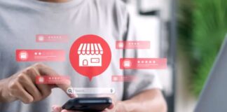 How to get reviews on directories? Person holding smartphone with digital overlay showing storefront icon and five-star ratings, illustrating how customers submit reviews on business directories.