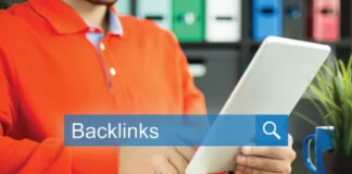 How to use directories for links Person holding tablet with backlinks search overlay at office desk, illustrating directory link research and navigation workflow for SEO strategy.