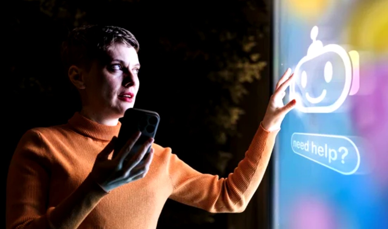 Person in orange sweater touches digital screen showing chatbot help interface while holding smartphone, illustrating utility advertising through problem-solving technology.