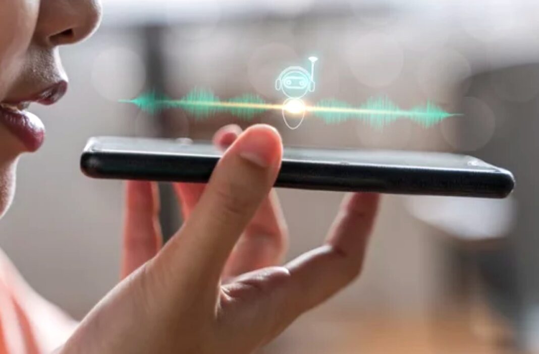 Voice assistant interaction demonstrates answer engine optimization through direct spoken query technology Person holds smartphone displaying voice assistant interface with robot icon and green waveform, illustrating voice-based answer engine optimization technology.