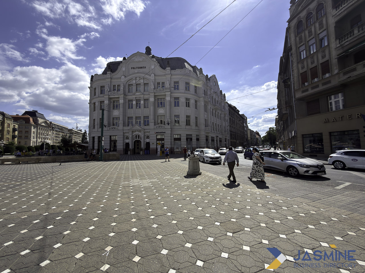 Grand Politehnica building overlooks an urban plaza in Timișoara, illustrating the type of city-specific landmark that strengthens local SEO content strategies.