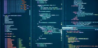 Why Database DevOps matters more than you think Computer monitor displaying syntax-highlighted programming code in a dark-themed development environment, illustrating the code infrastructure behind single page application technical SEO.