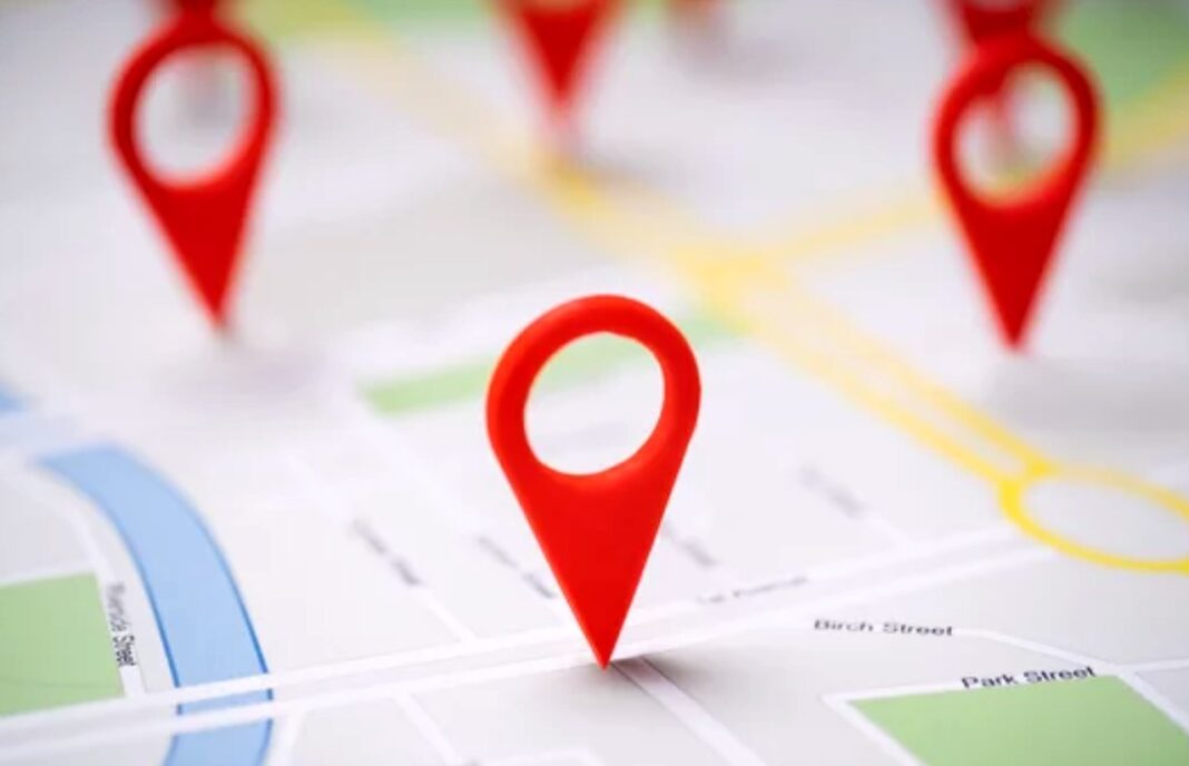 Map pin markers illustrate local business location visibility for Google Maps ranking strategies Three red location pin markers stand on a street map showing roads and landmarks, representing local business visibility in Google Maps search results.