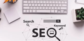 The End of SEO as We Know It? Overhead view of a desk workspace with SEO concept graphic showing interconnected icons and network lines, illustrating the changing nature of search engine optimization strategies.
