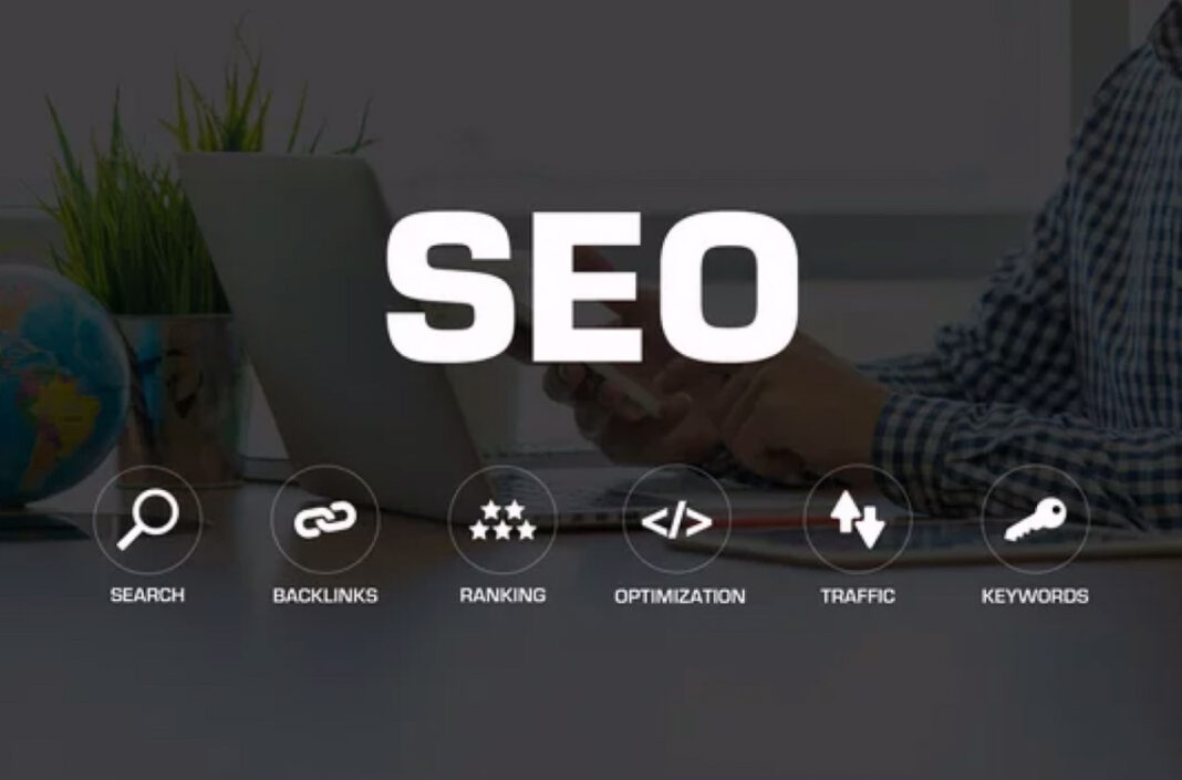 Graphic illustration of search engine optimization fundamentals for modern digital marketing strategy Digital graphic showing 'SEO' text with circular icons representing optimization elements overlaid on a workspace with hands typing on laptop, illustrating modern search engine optimization strategy.