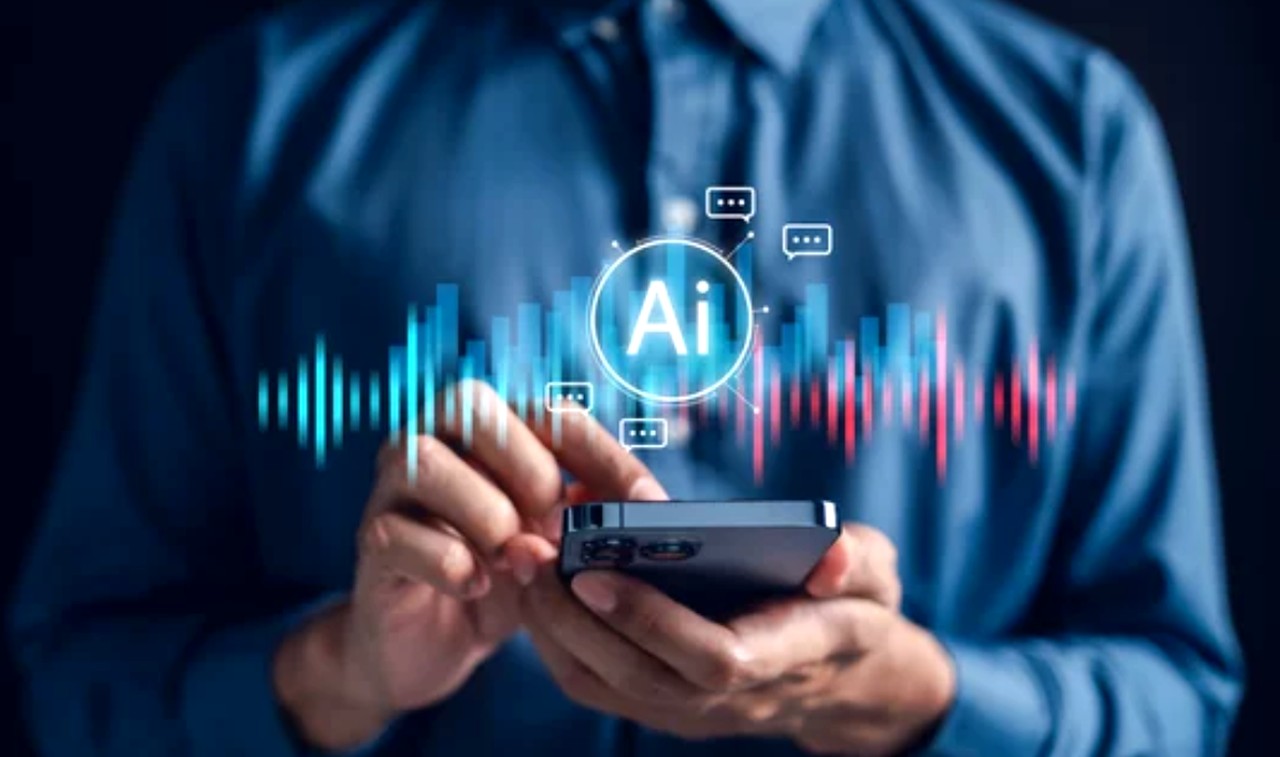 Business professional holds smartphone displaying holographic AI interface with waveforms and chat icons, representing advertising opportunities on IoT and connected devices.