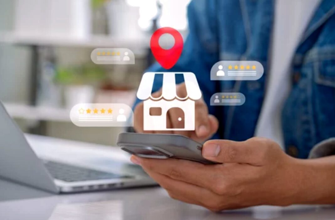 Mobile technology enables customers to share local business reviews and ratings instantly Hands holding smartphone with overlaid graphics of star ratings and storefront icon, illustrating how customers write and read local business reviews.