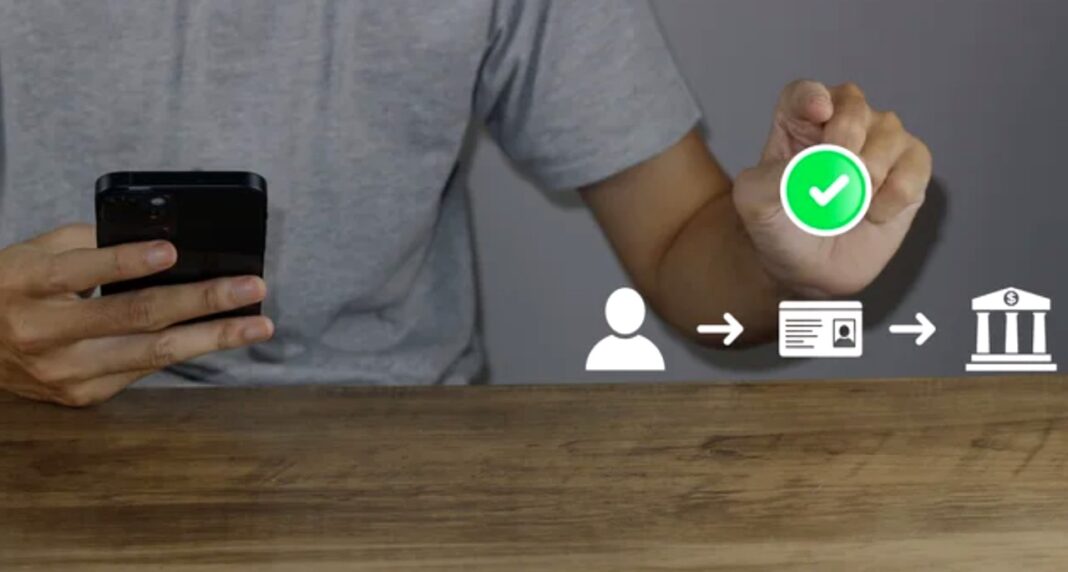 Mobile verification process illustrates blockchain-based authentication for marketing claim validation Person holds smartphone displaying digital verification workflow with green checkmark icon, demonstrating blockchain-based authentication systems used to validate marketing claims.