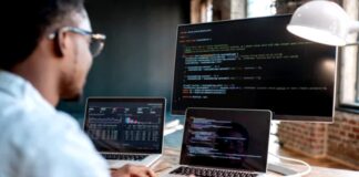 The Most Important Skill for Future SEO Developer working at multi-monitor workstation with code and data visualizations displayed, representing the analytical and technical skills required for modern SEO professionals.