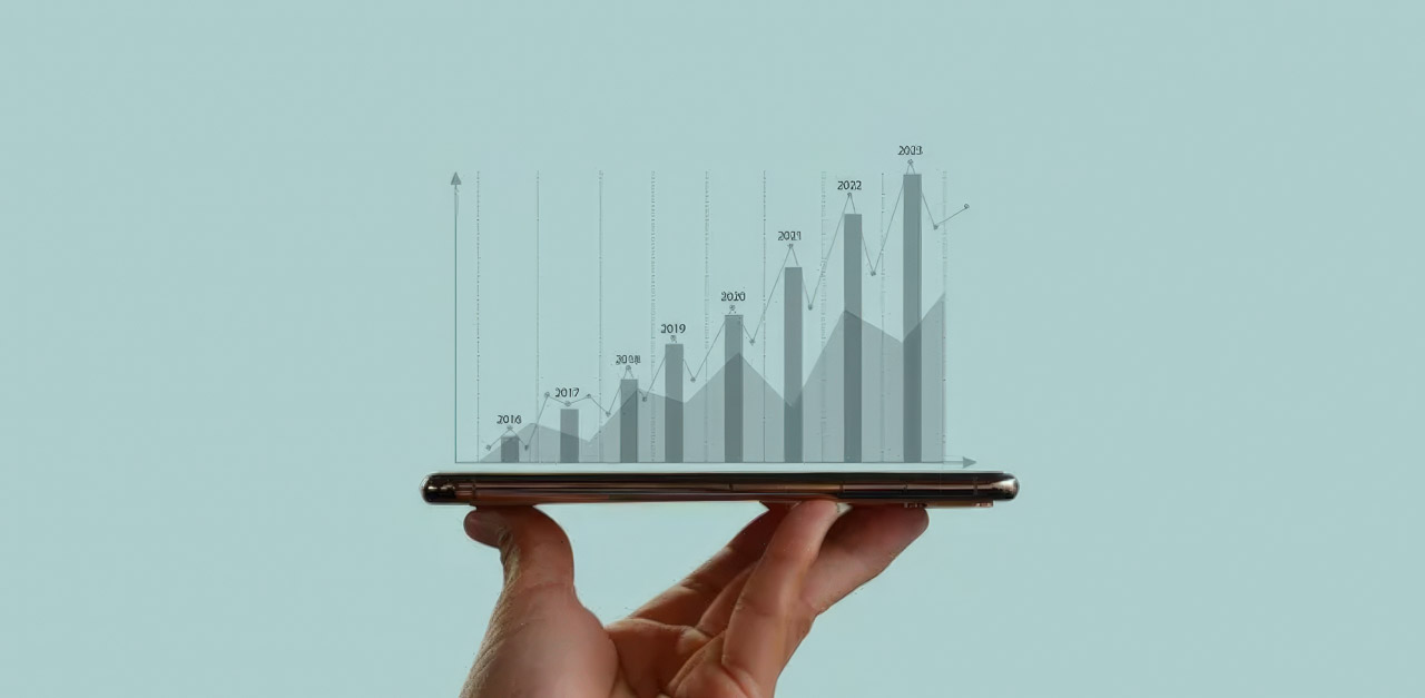 Hand holding tablet displaying holographic bar chart showing growth trends from 2016 to 2023, representing the evolution of digital advertising analytics and metrics.