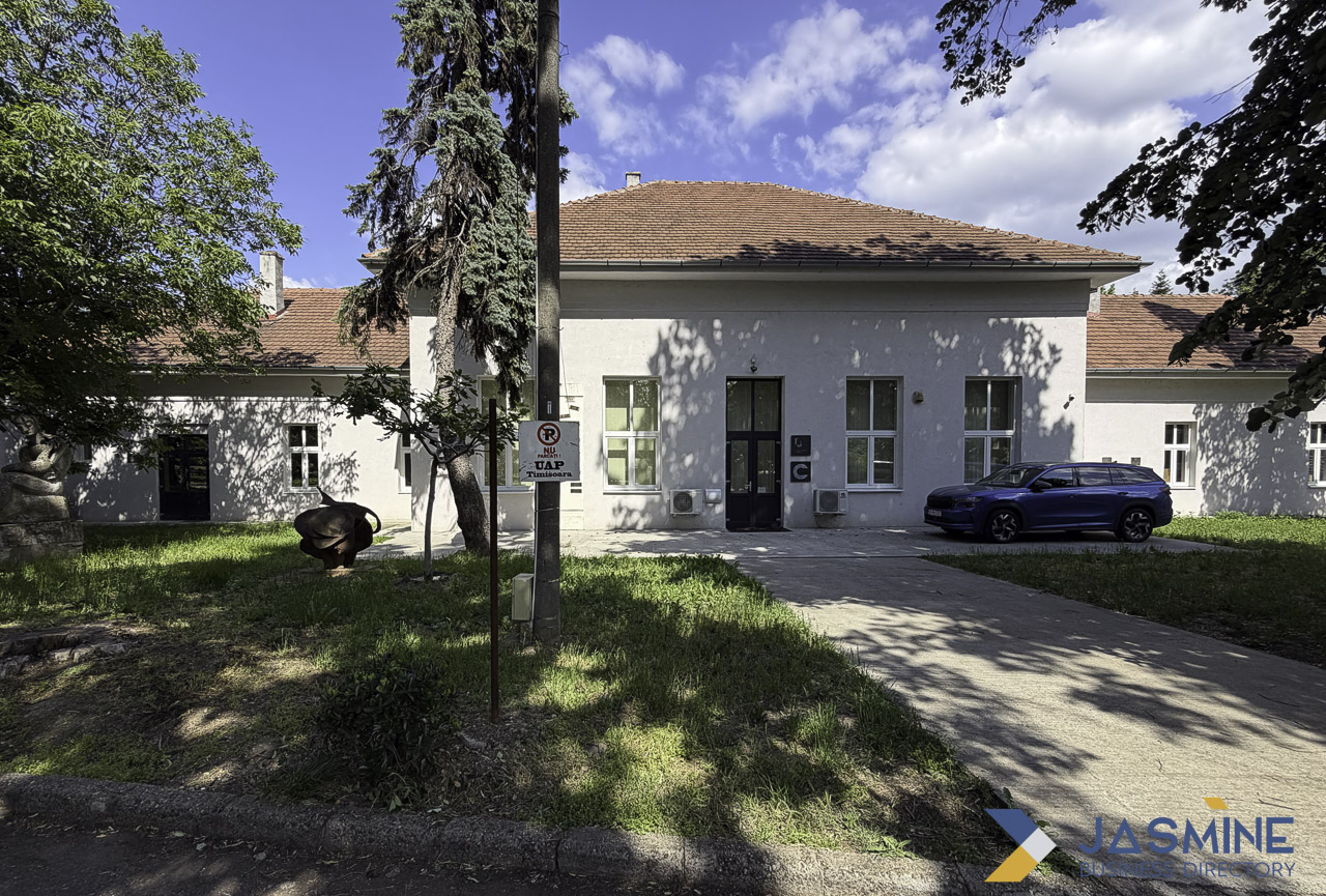 White single-story building with terracotta tile roof and blue SUV parked in driveway, representing the everyday residential spaces where creative hobbies flourish.