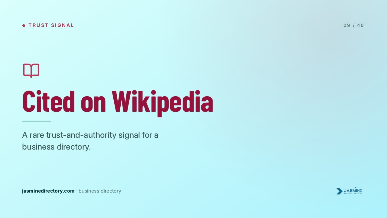 Presentation slide displaying a red book icon and 'Cited on Wikipedia' heading on light blue background, illustrating trust factors for business directory category searches.
