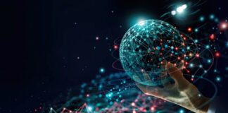 Advertising in the “Fediverse”: Decentralized Social Media Strategies Hand holding a glowing cyan wireframe sphere with network connections and light trails, representing decentralized social media and digital connectivity strategies.